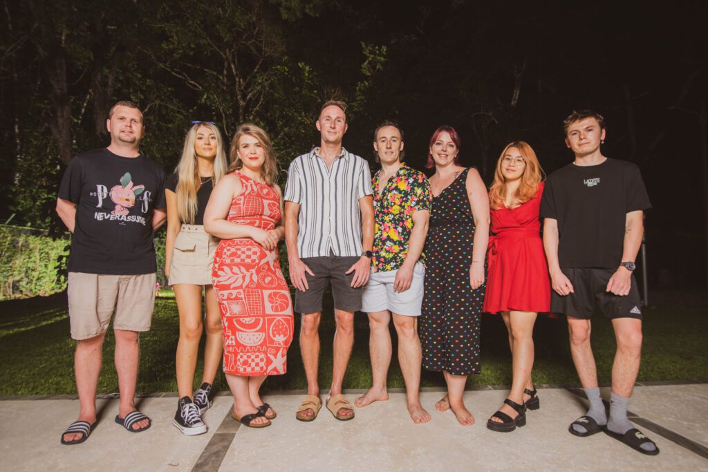 Group of people standing in front of trees